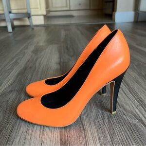 Brand new, never worn Shoes of Prey pumps in bright orange leather.